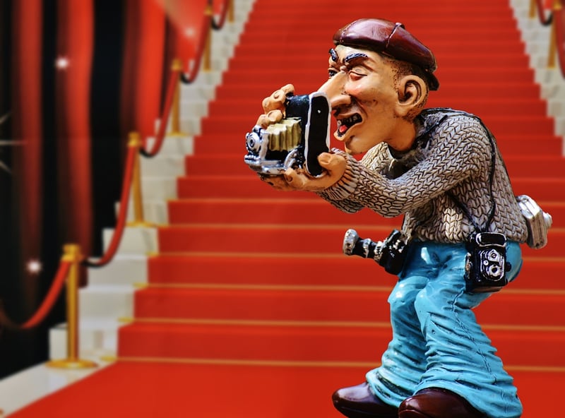 Paparazzi capturing celebrities at an event
